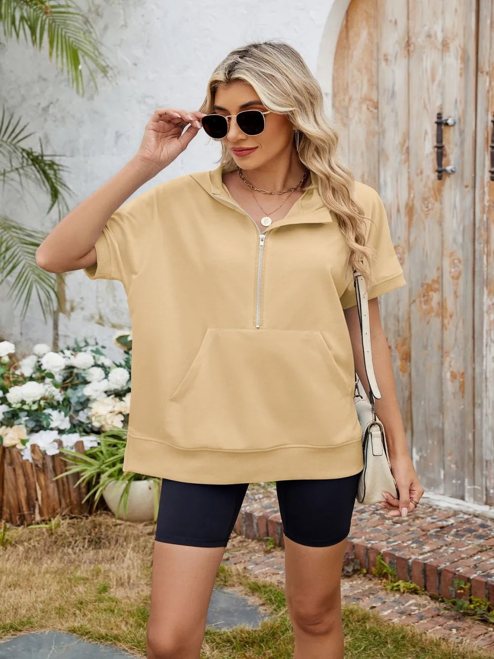 Plush Fashion Hub short sleeve hooded half zip top in black, featuring a casual design with a hood and half zipper front.