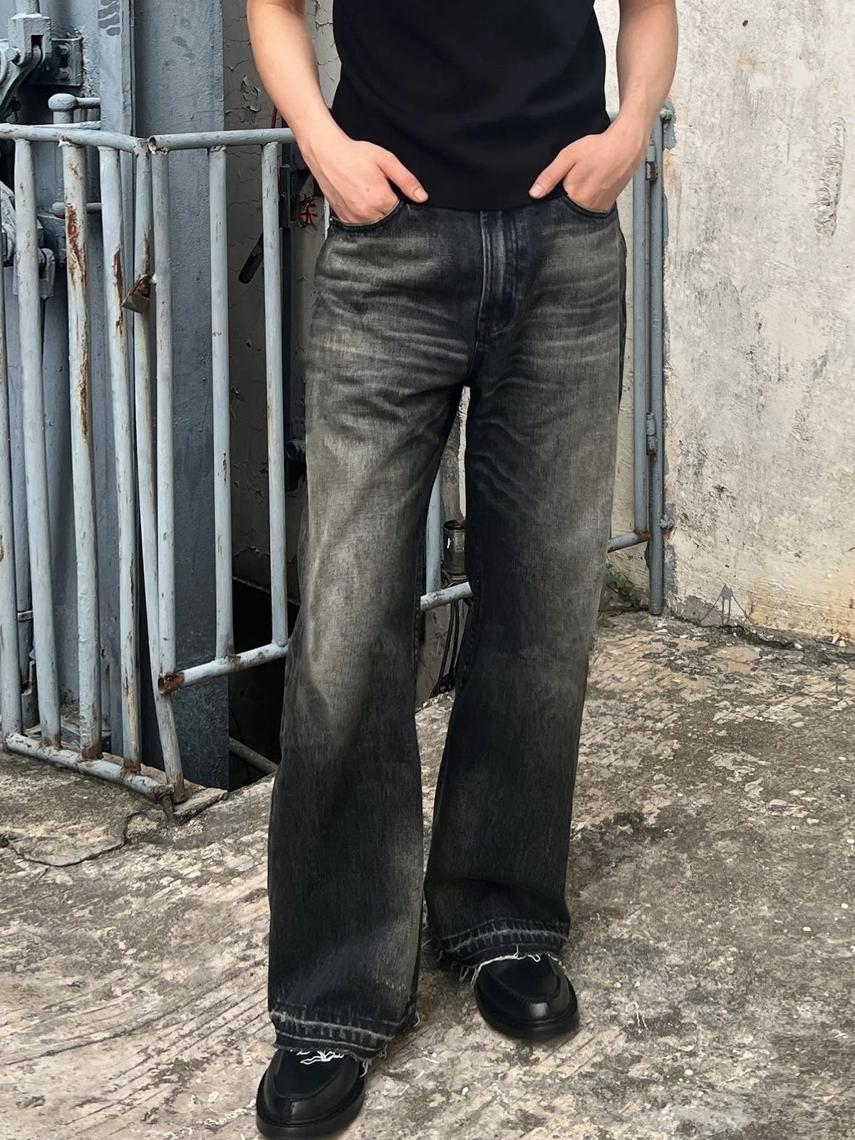 Men's vintage washed denim jeans with frayed hem from Plush Fashion Hub, showcasing classic denim fabric and distressed style.