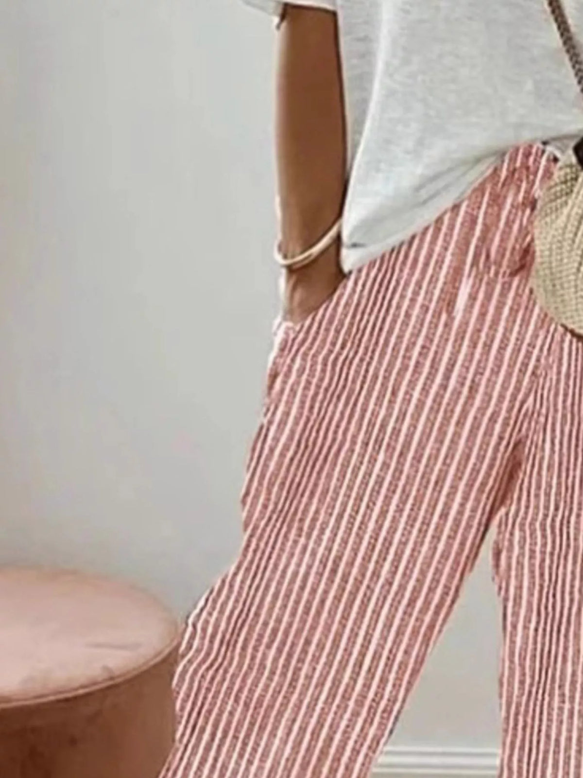Striped cropped pants by Plush Fashion Hub featuring a relaxed fit and stylish horizontal stripe pattern.