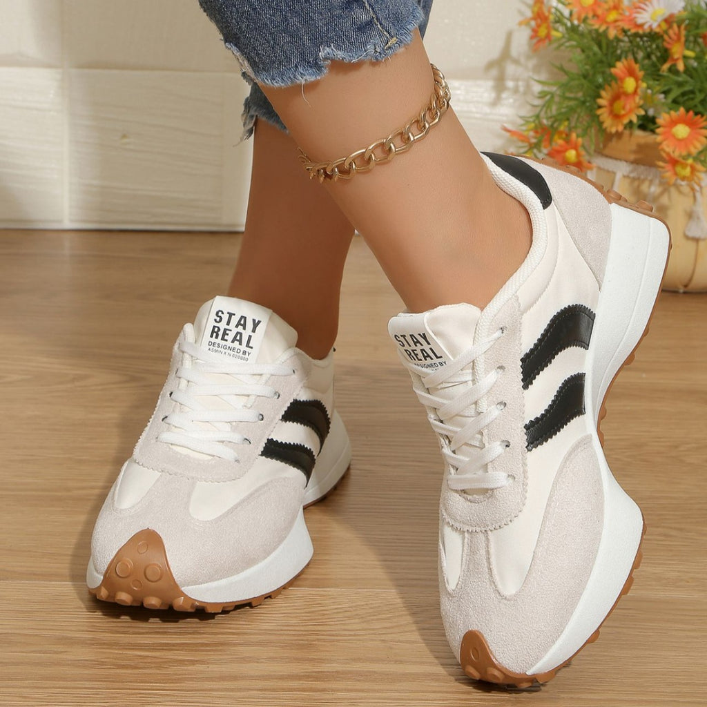Women's round toe lace-up flat casual sneakers by Trendsi, made of comfortable PU leather with a stylish, everyday design.