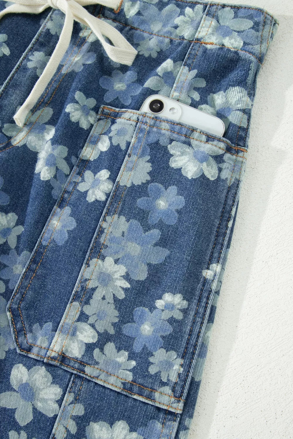 Dainty floral printed drawstring barrel jeans from Plush Fashion Hub, featuring a relaxed fit and floral pattern design.