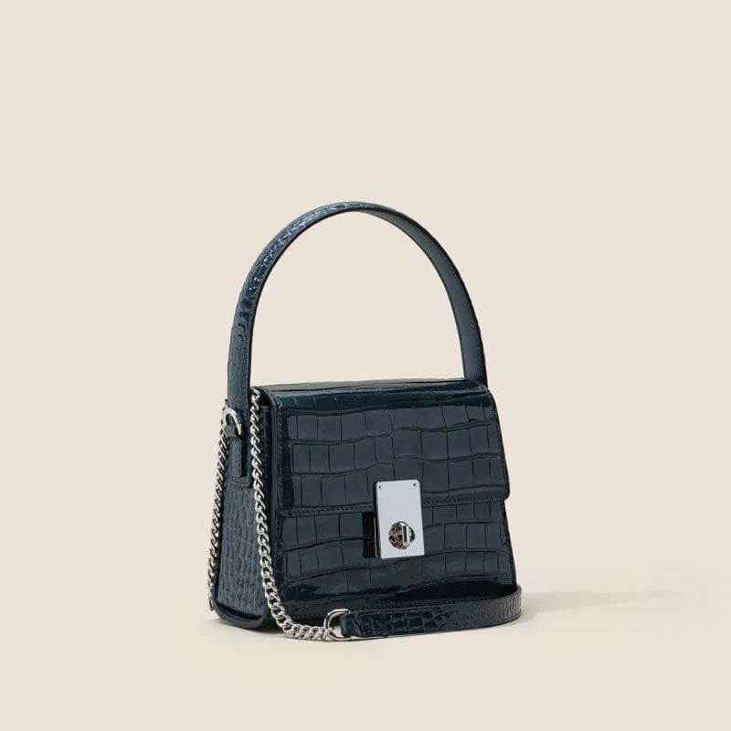 New leather handbag in trapezoid shape with single shoulder strap.