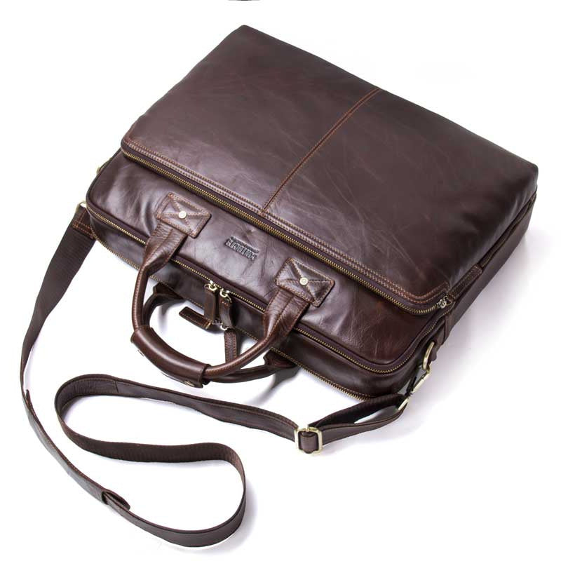 Large capacity Pi-Mart men's casual leather business briefcase with shoulder strap, ideal for professional storage and organization.