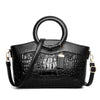 Luxury handbags for moms with crocodile print and plaid design.