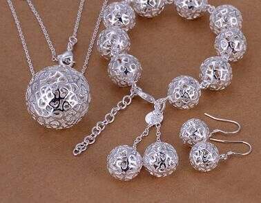 Silver-plated fine jewelry set with three-dimensional ball pendant and bracelet.