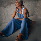 Women’s wide leg denim overalls by FitiqueFit, casualwear style, featuring adjustable straps and a relaxed fit on light blue denim.