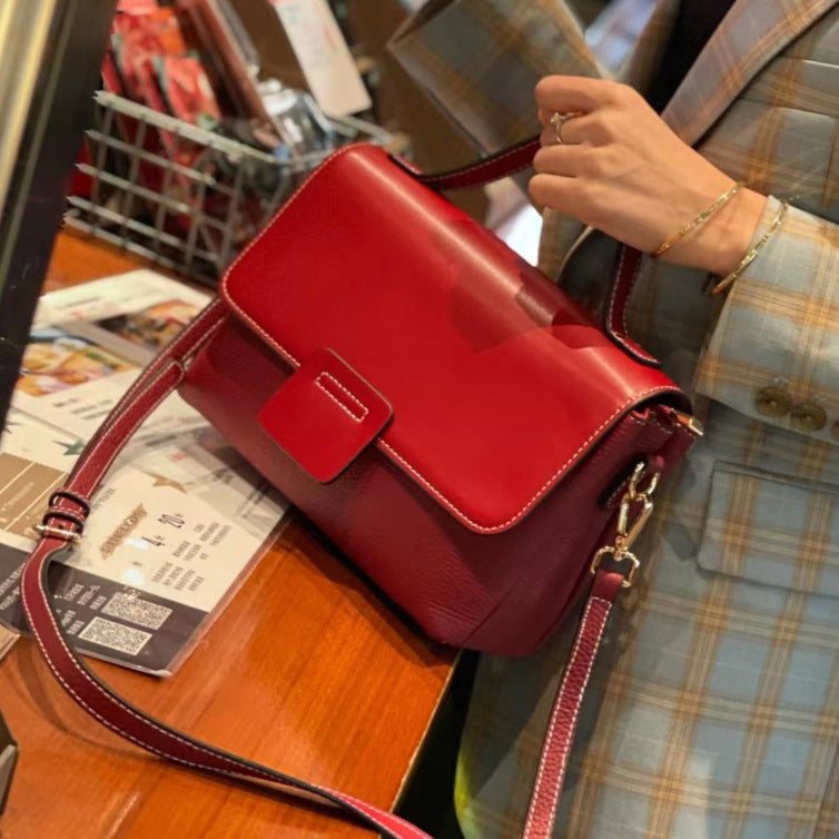 Leather Handbags New Style Single-shoulder Messenger BagThis leather handbag is a must-have for any fashion-forward individual. Made with high-quality leather, it exudes a retro vibe with its belt decoration and car stitcHandbagsPlush Fashions ShopPlush Fashion Shop