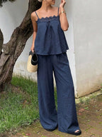 Lace trim cami top and wide-leg pants set by Trendsi, featuring a coordinated matching set with delicate lace details.