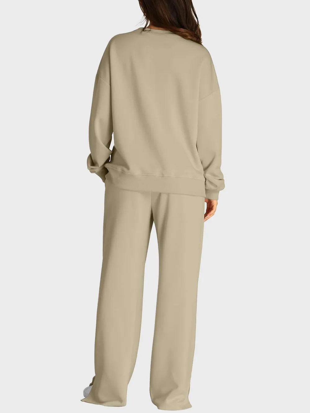 Trendsi round neck long sleeve top paired with slit pants set, stylish and comfortable casual outfit, black fabric, front view.
