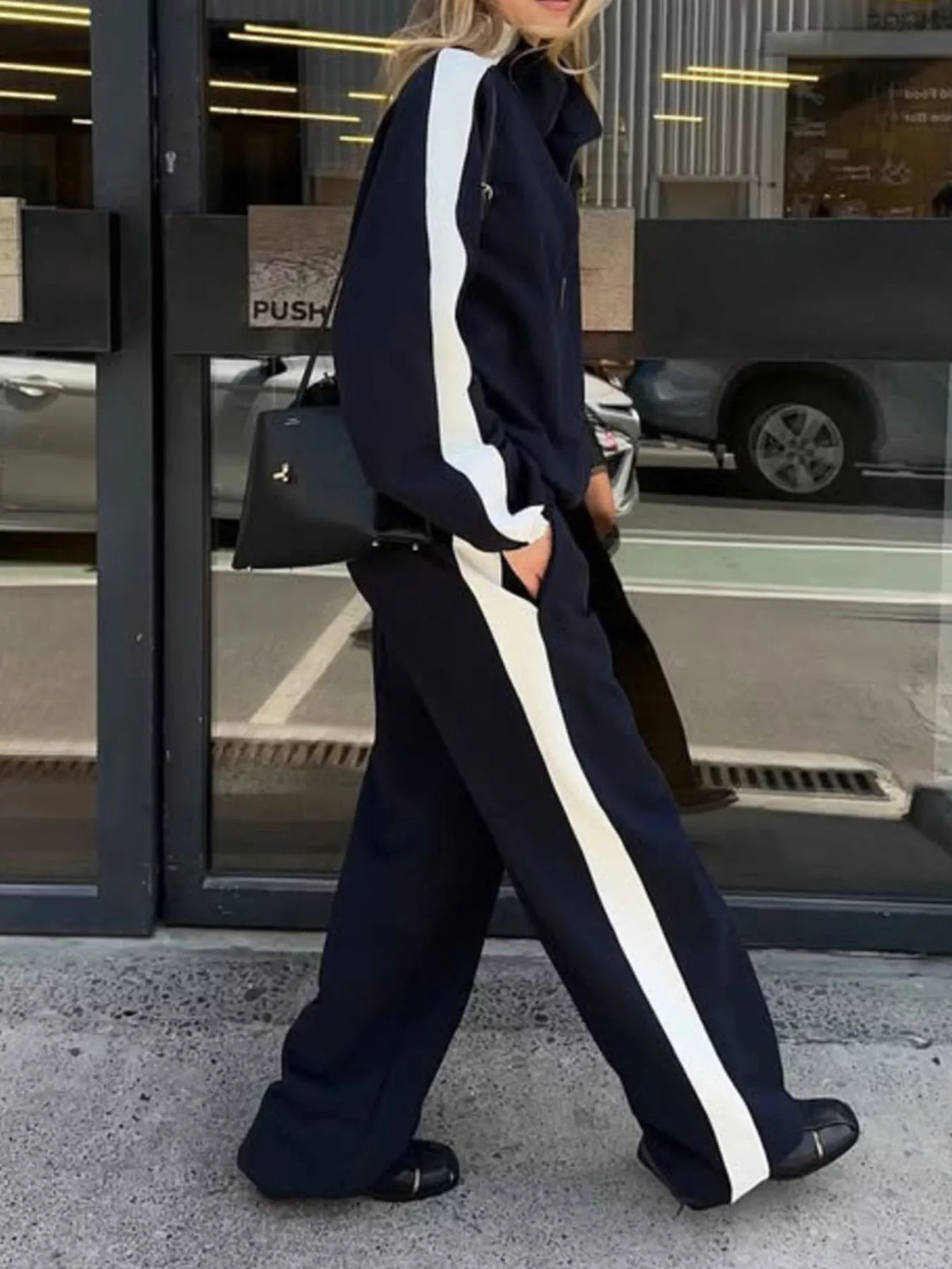 Plush Fashion Hub zip-up long sleeve tracksuit set featuring a comfortable, stylish design with a matching top and pants.