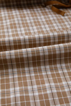 Casual plaid print pants with tie detail from Trendsi, featuring a relaxed fit and stylish pattern on soft fabric.