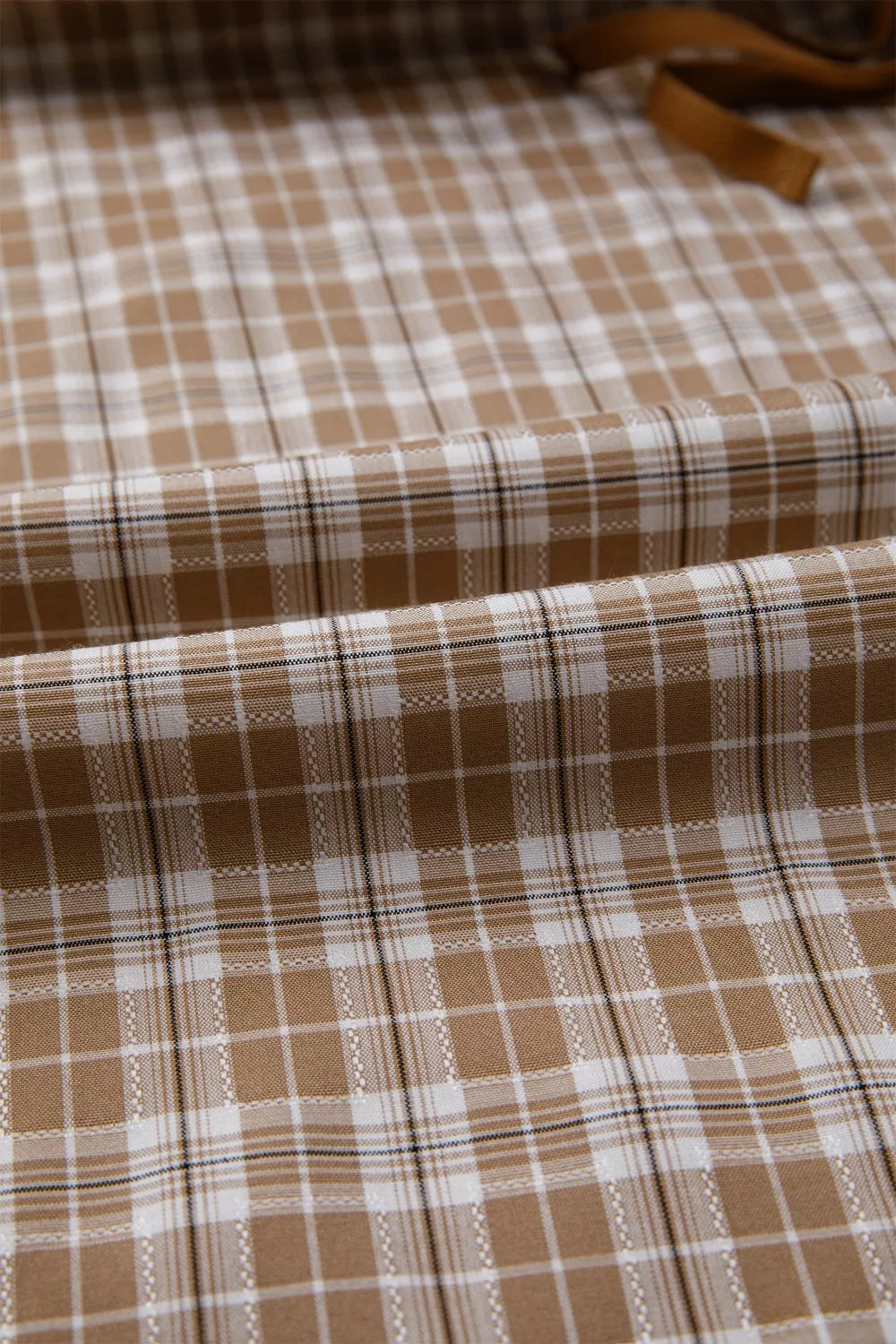 Casual plaid print pants with tie detail from Trendsi, featuring a relaxed fit and stylish pattern on soft fabric.