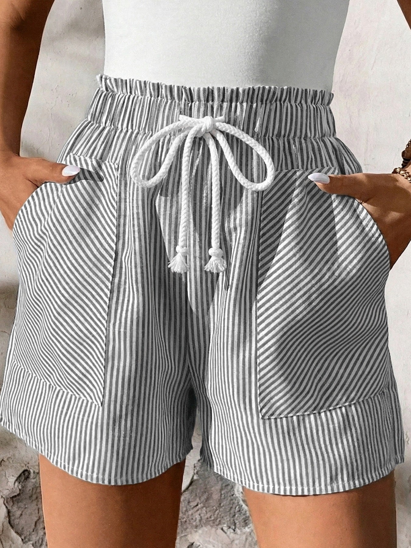 Women's striped elastic waist drawstring shorts by Trendsi, casual summer beachwear bottoms with a relaxed fit and comfortable design.