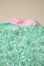Floral midi dress with flutter sleeves and contrast trim from Trendsi, featuring a feminine, flowy design.