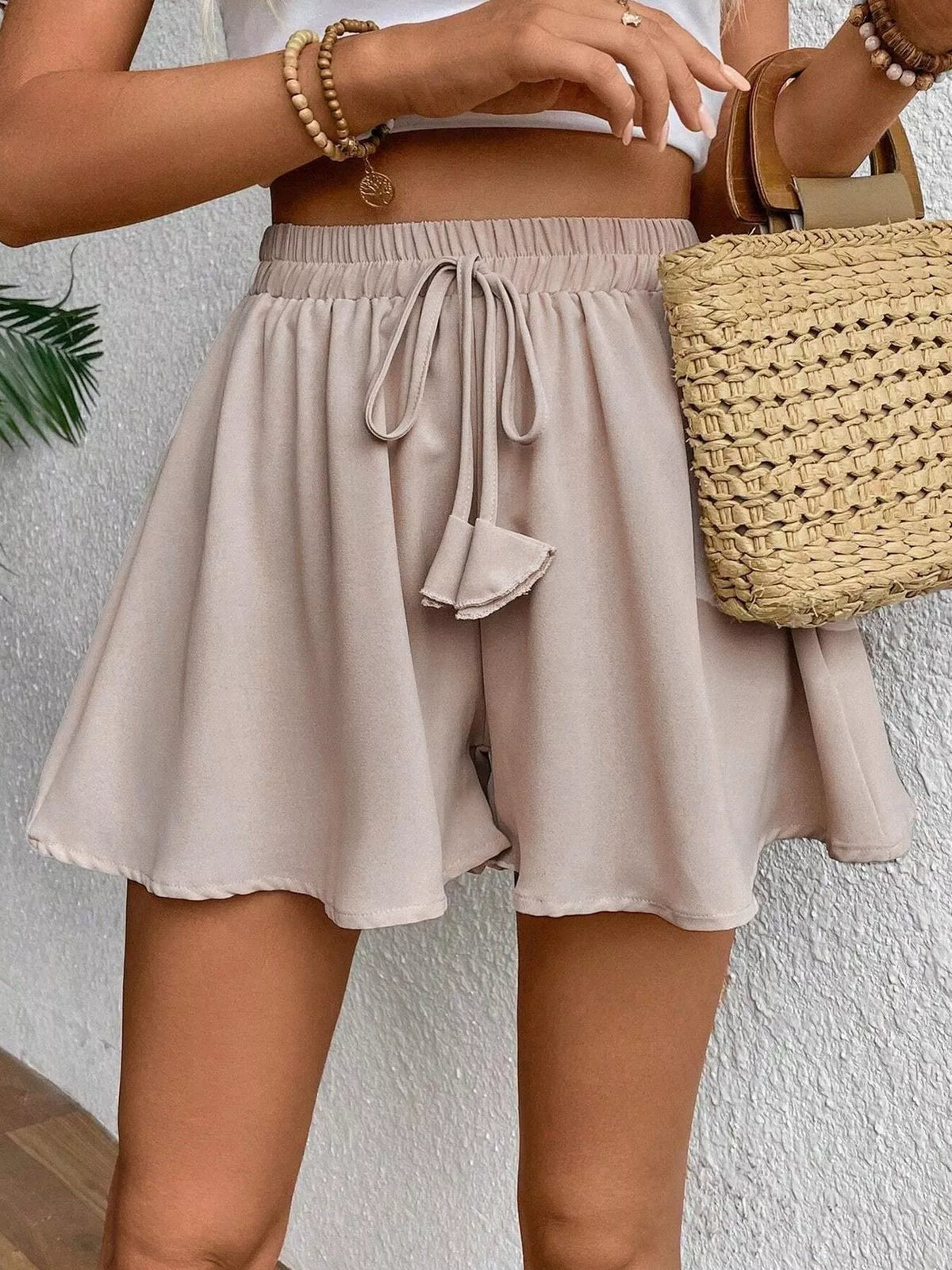 Plush Fashion Hub flowy romper with drawstring waist, lightweight fabric, and casual style, ideal for comfortable summer wear.