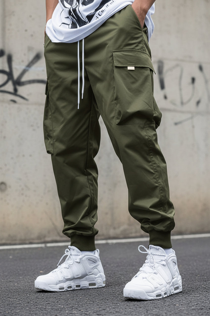 Men’s multi-pocket drawstring cargo pants from FitiqueFit, streetwear style, featuring multiple cargo pockets and adjustable drawstring waist.