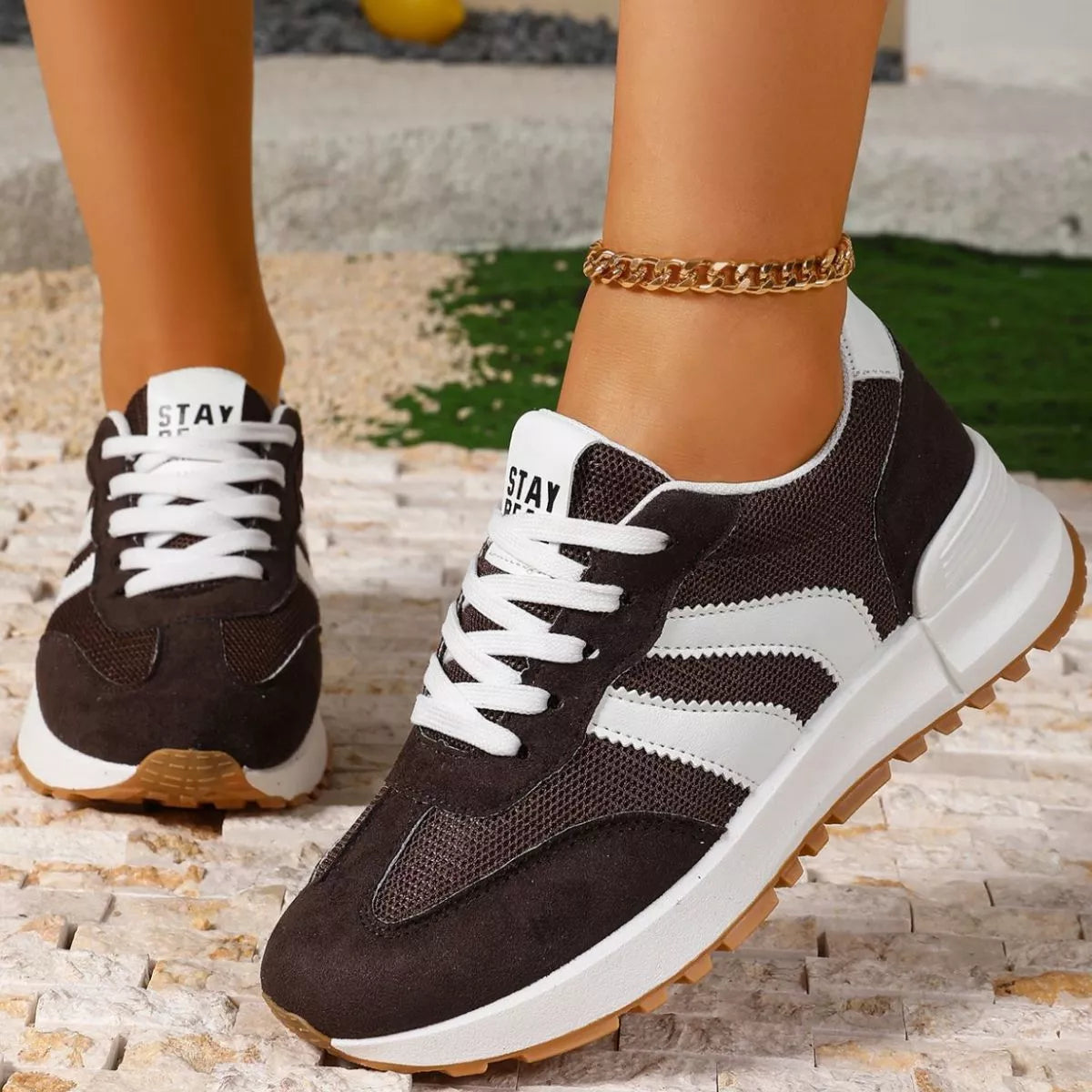 Women's round toe lace-up sneakers by Trendsi featuring casual design and white laces on a clean canvas background.