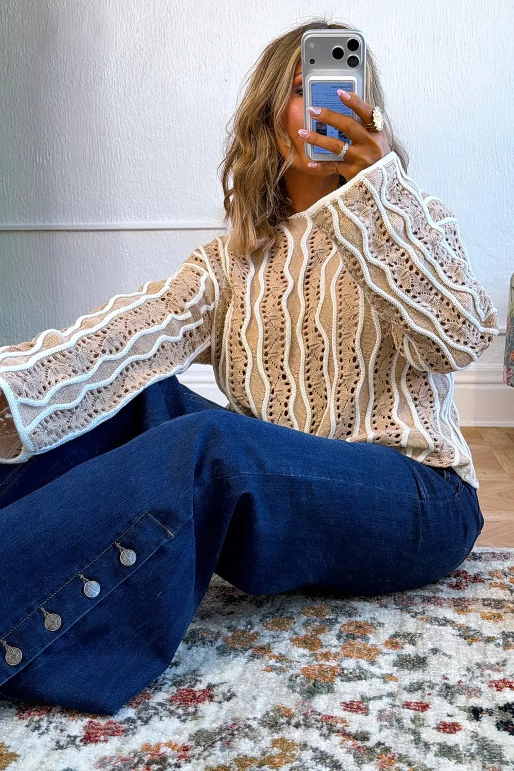 Wavy striped openwork knit top for women, featuring contrast design and lightweight fabric, ideal for casual styling.