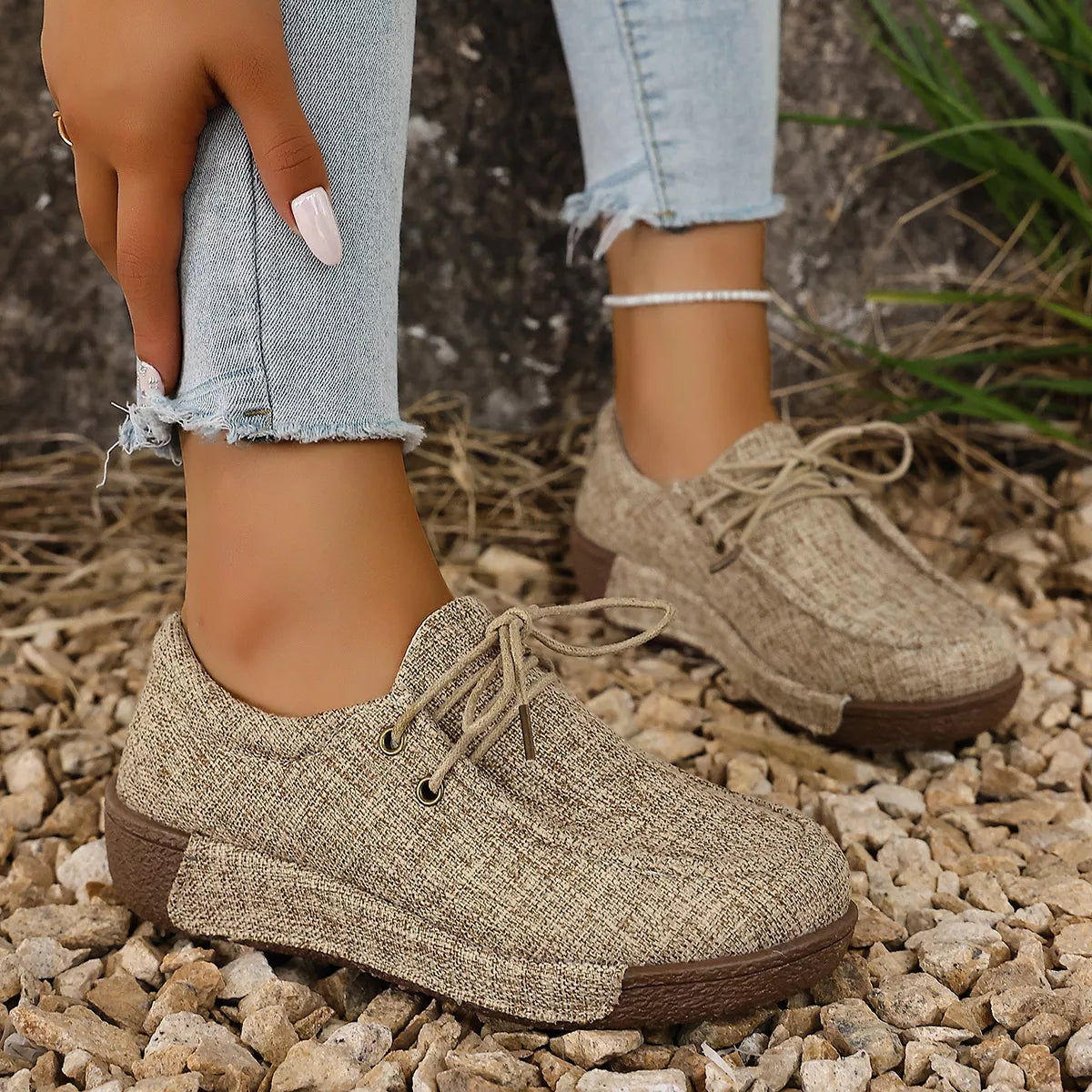 Trendsi round toe lace-up sneakers featuring a sleek design and white laces, perfect for casual footwear.