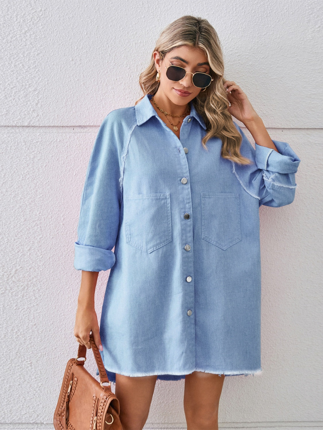 Raw hem button-up denim dress by Plush Fashion Hub, showing the casual style with front buttons and distressed hem detail.
