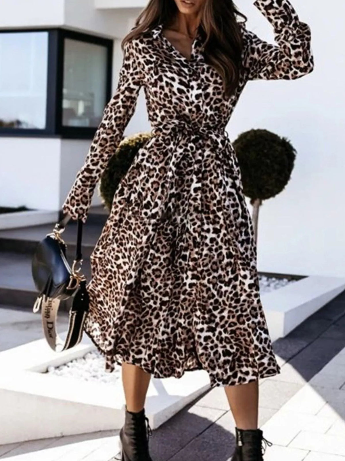 Leopard print button-down midi dress with belt by Trendsi, featuring long sleeves and a stylish, fitted silhouette.