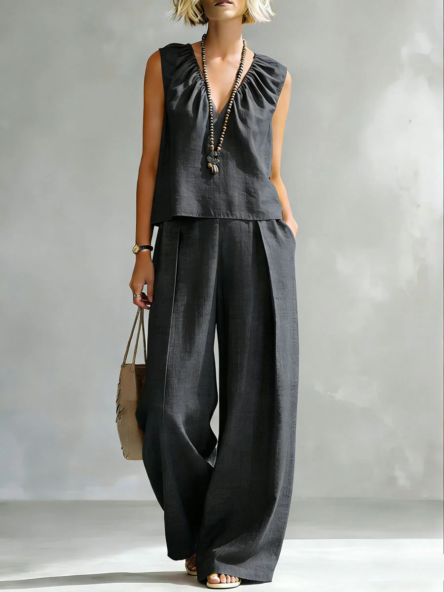 Women's sleeveless cotton-linen shirt and pants set by FitiqueFit, featuring a casual, relaxed fit in neutral tones.