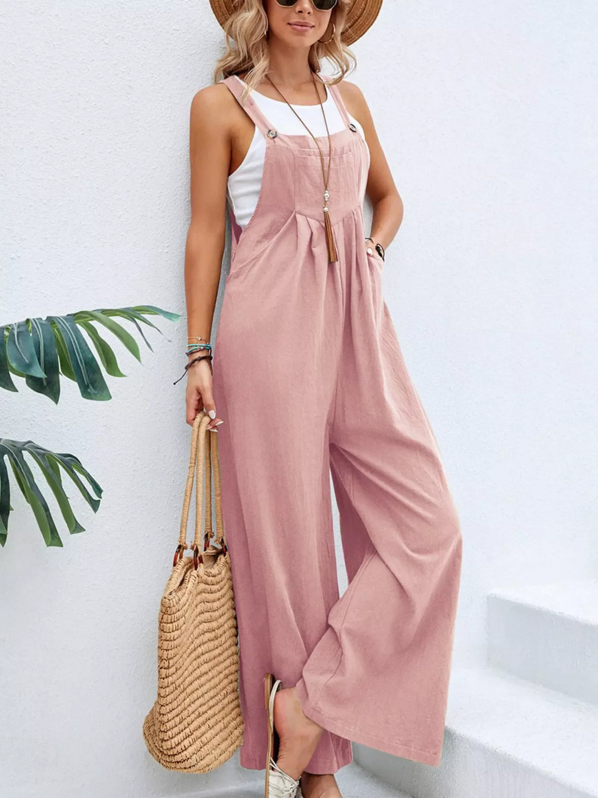 Plus size casual wide-leg jumpsuit with pockets by Plush Fashion Hub, featuring a full-size, relaxed fit overalls design.