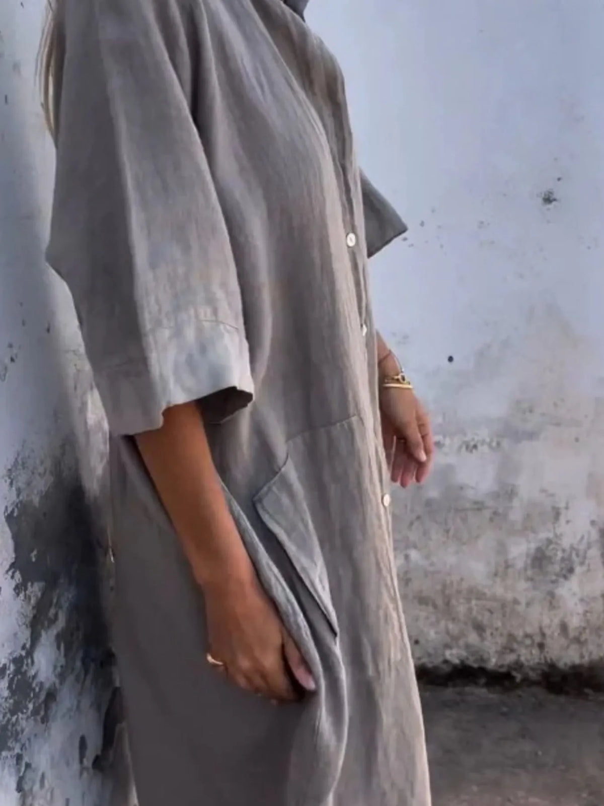 Plus size linen button-down shirt dress by Trendsi, casual full-size dress with collar and long sleeves, shown on a hanger.