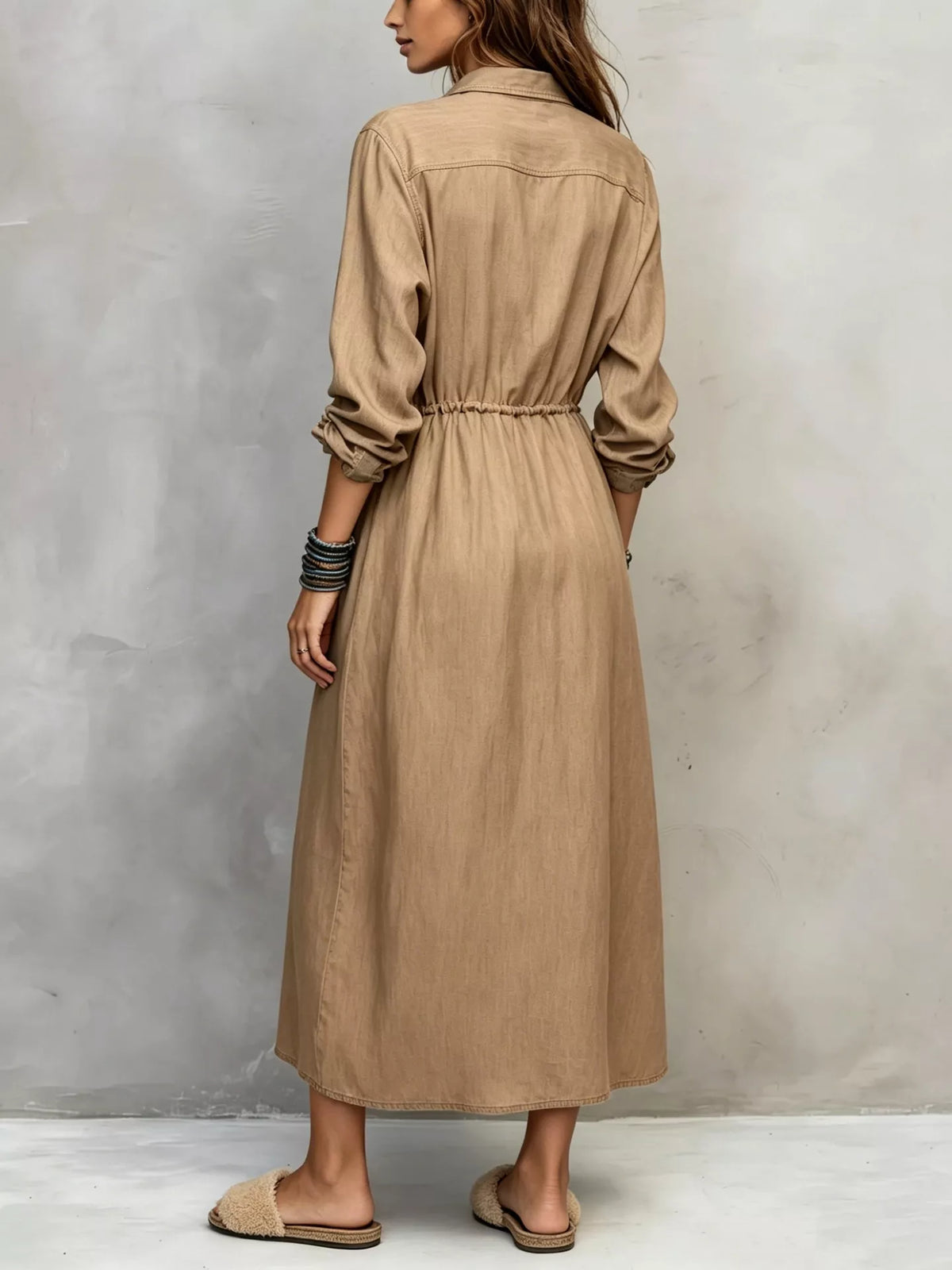 Plus size long sleeve button front shirt dress by Trendsi, featuring a casual, comfortable fit with a collar and front buttons.