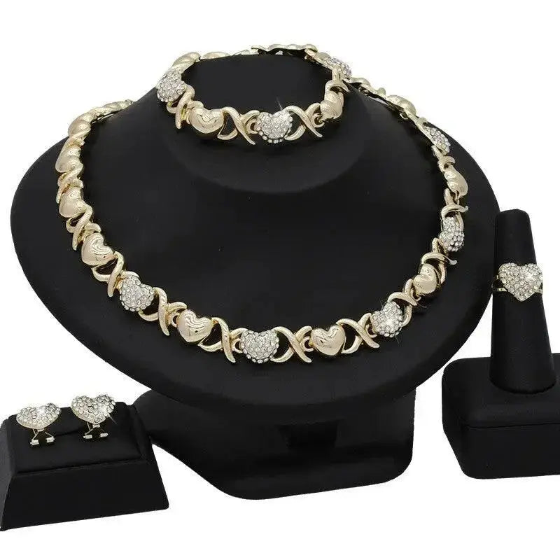 18K gold heart-shaped pendant necklace and matching earrings jewelry set for women featuring elegant gold design.