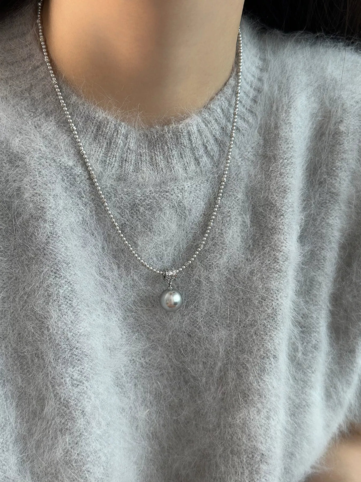 Elegant pearl pendant necklace featuring a single lustrous pearl on a delicate chain, stylish jewelry from Plush Fashion Hub.