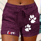 Women's printed elastic waist cropped casual shorts with pockets by Plush Fashion Hub, featuring colorful patterns and comfortable fit.