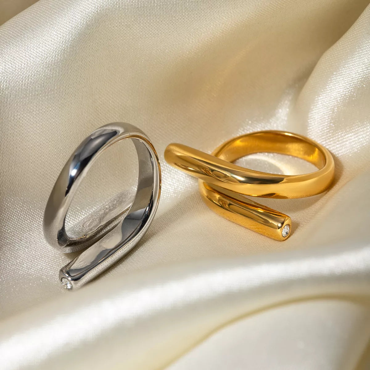 Stainless steel bypass ring from Plush Fashion Hub, featuring a sleek, modern design with smooth, curved band.