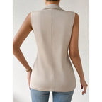 Women's sleeveless open-front vest blazer by FitiqueFit, stylish work and office jacket, shown in a professional setting.