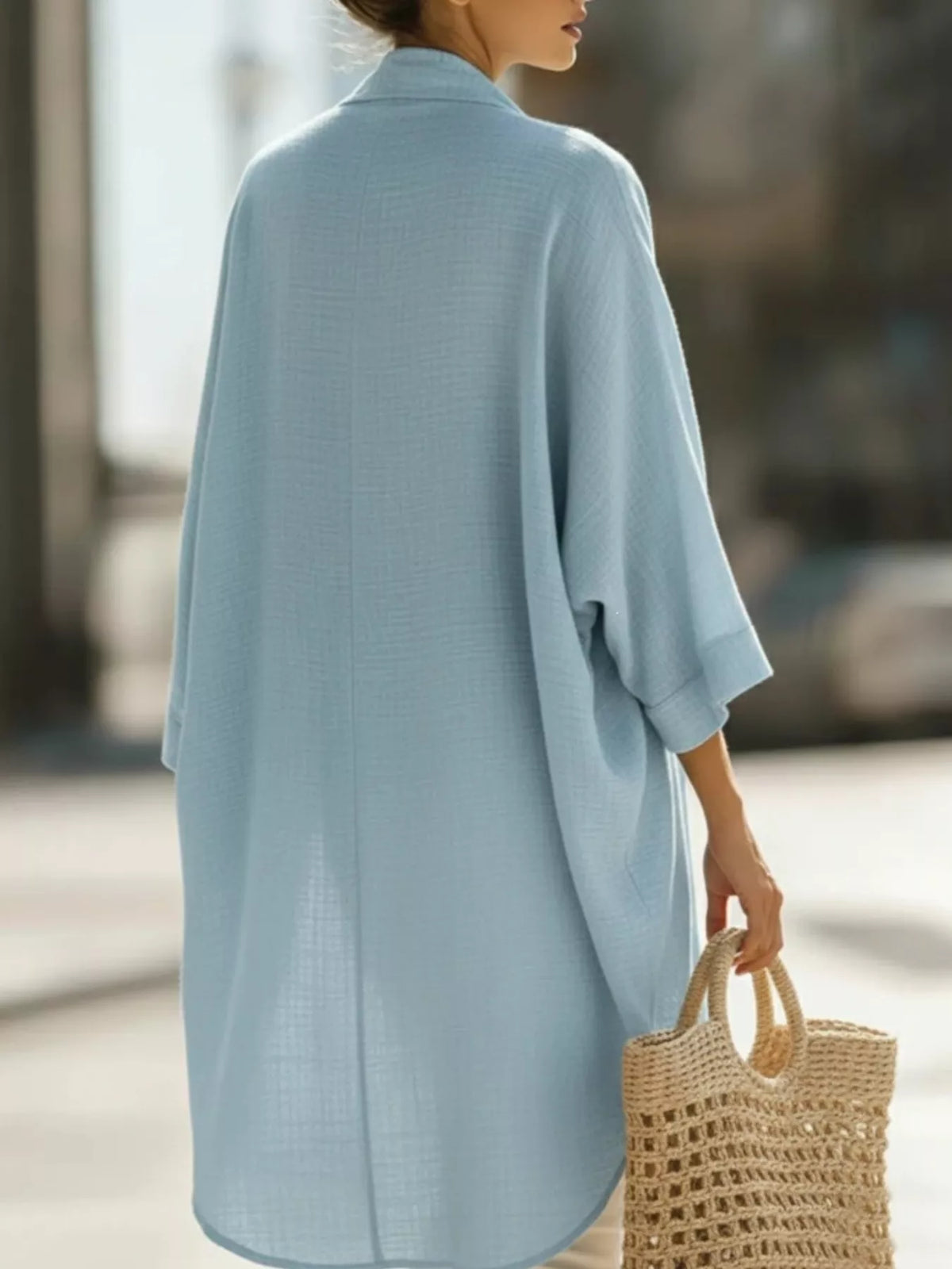 Plus size open-front cardigan and matching tank top set by Trendsi, featuring soft knit fabric and relaxed fit.
