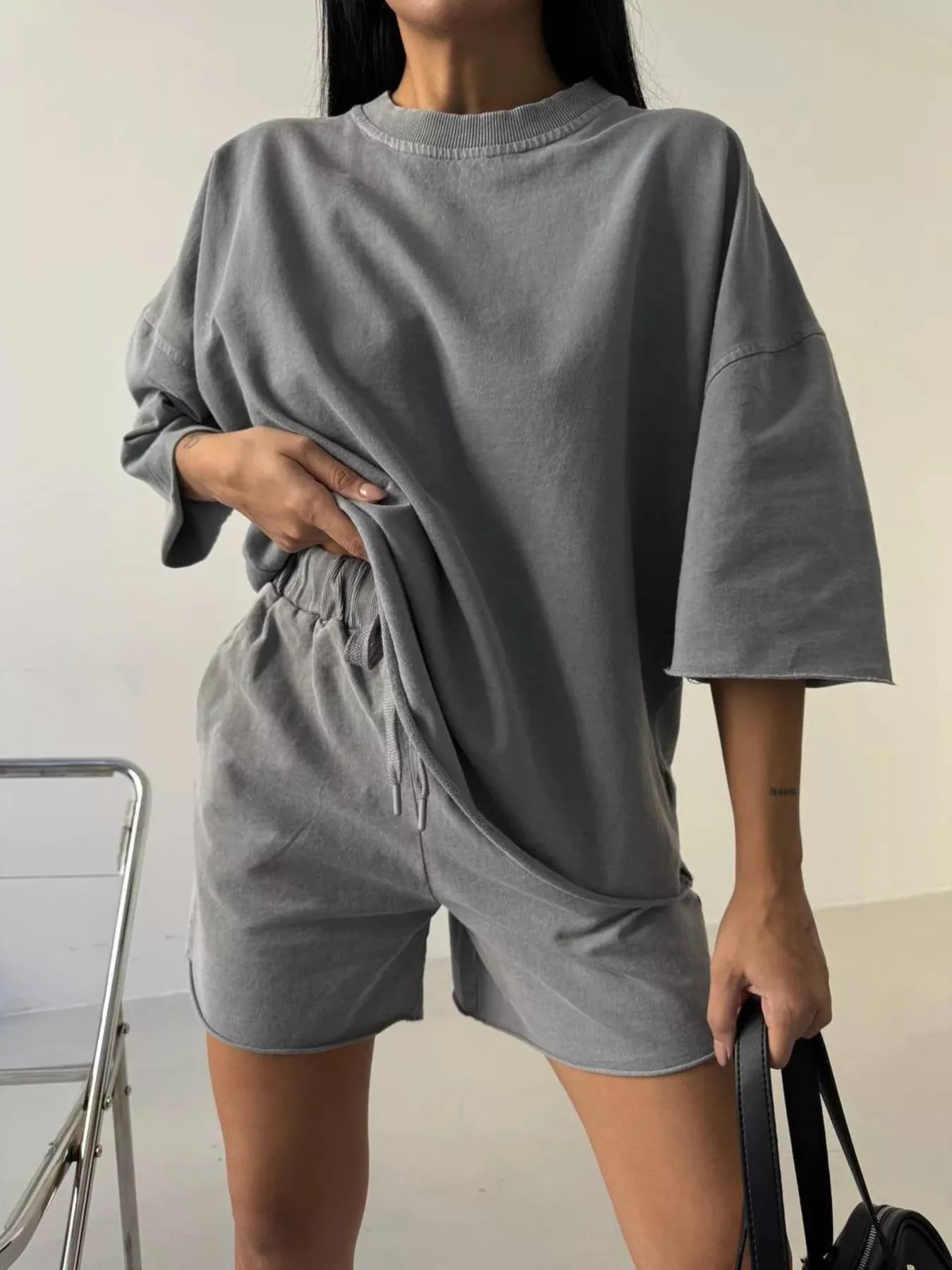 Vintage wash oversized lounge set by Plush Fashion Hub featuring a relaxed tee and matching shorts in soft, comfortable fabric.