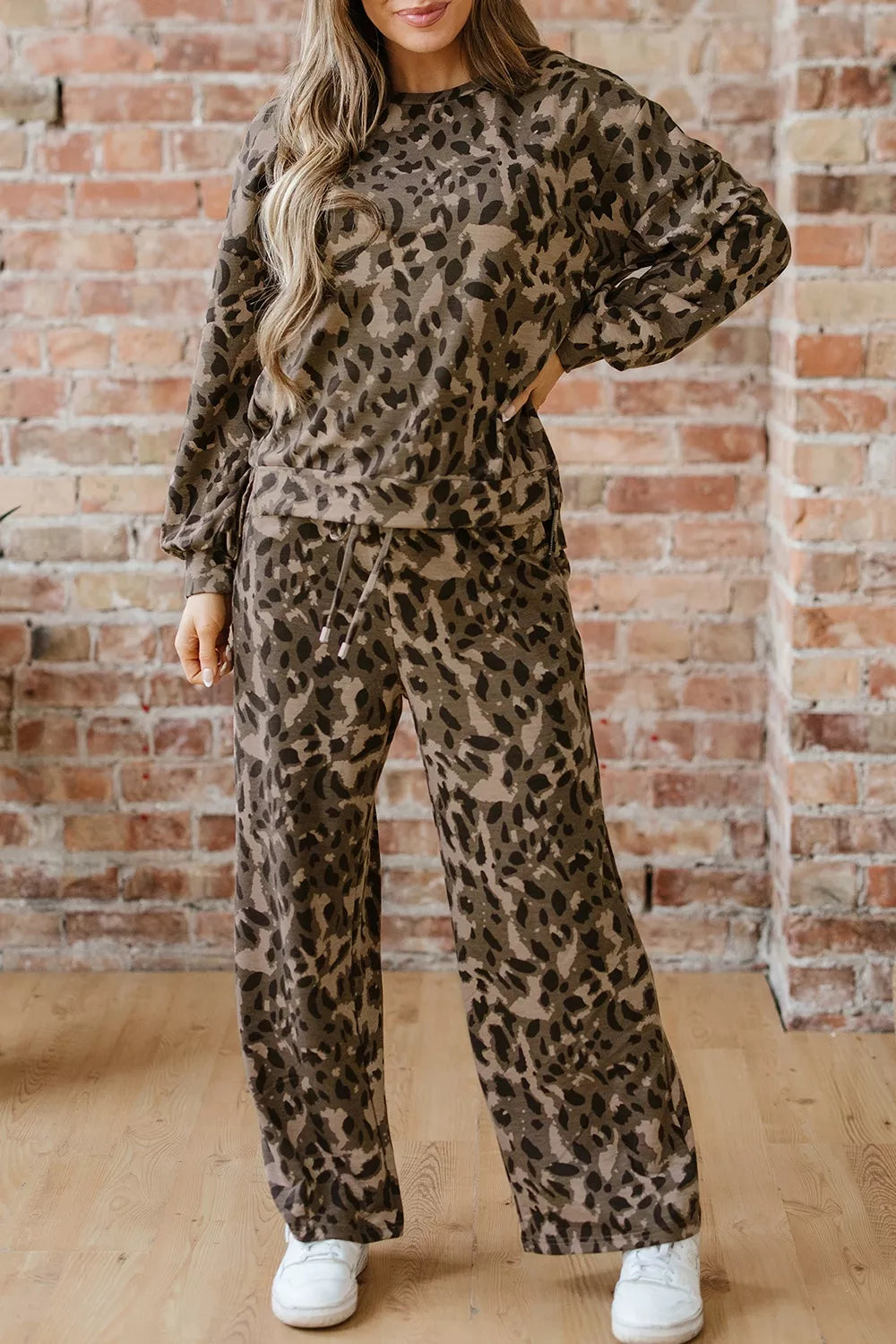 Leopard print long sleeve top and matching pants set by Trendsi, featuring a stylish animal print design and comfortable fit.