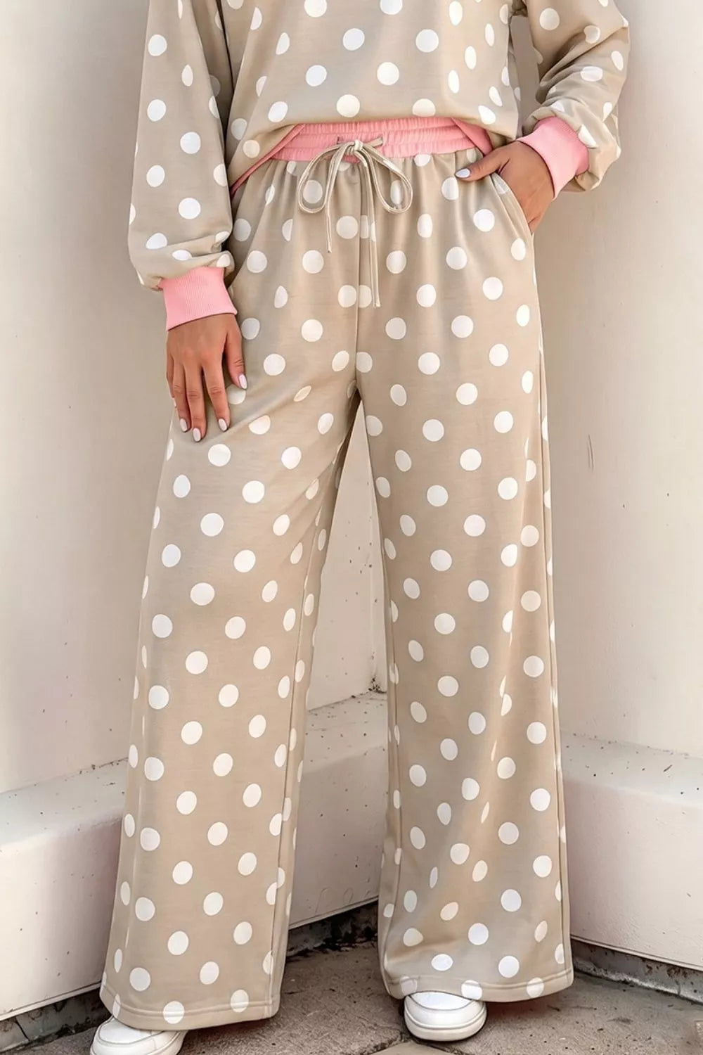 Polka dot contrast trim long sleeve top and drawstring shift pants set by Trendsi, shown in a coordinated outfit with polka dot pattern.