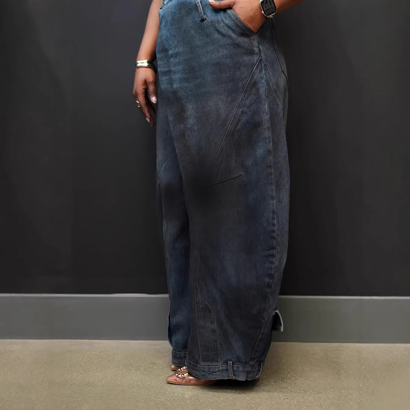 Retro distressed reversed-waist denim jeans by Plush Fashion Hub, showing fitted cut and vintage washed blue fabric.