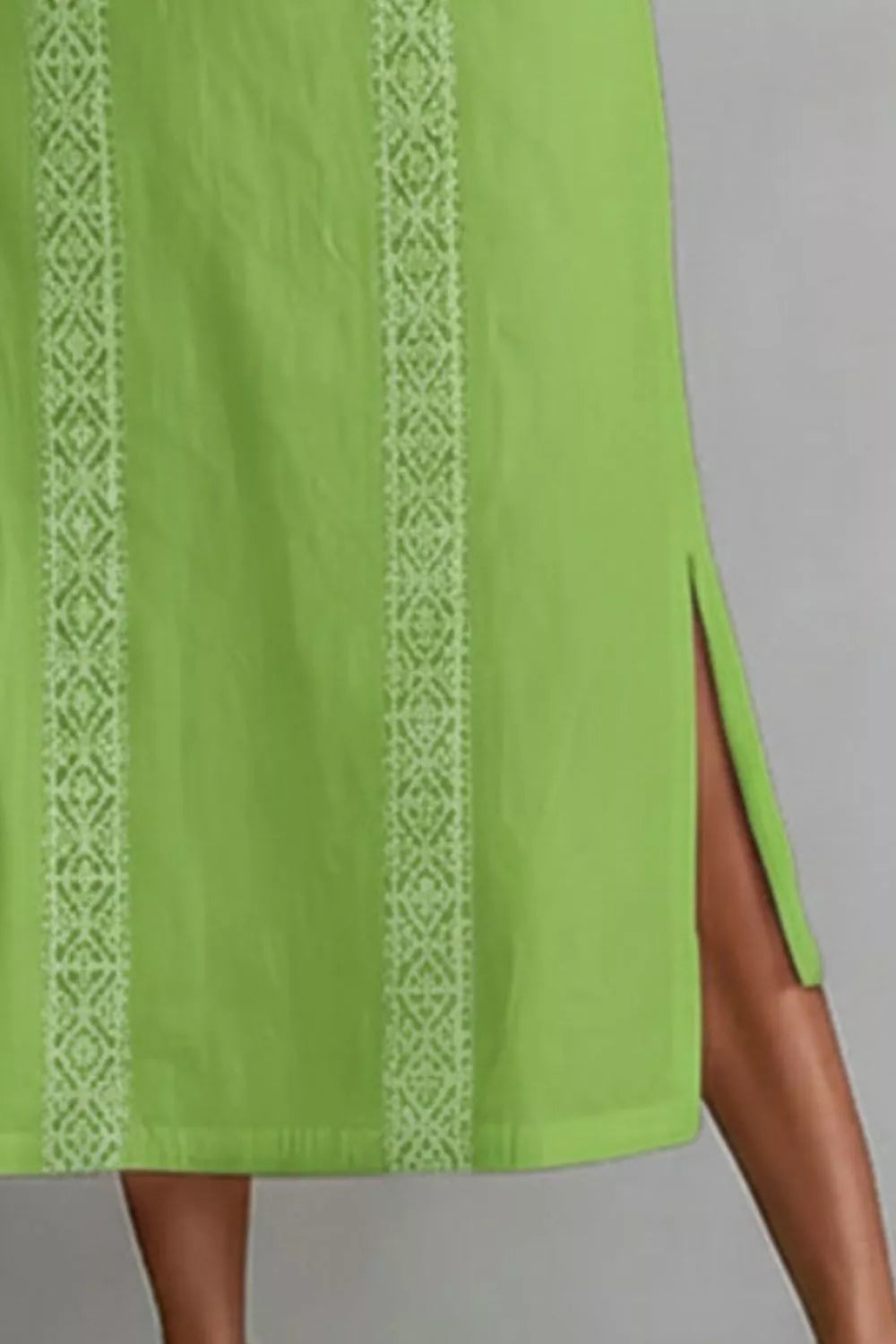Women's sleeveless maxi dress with side slit and pockets, featuring a flowy silhouette and trendy design from Trendsi.
