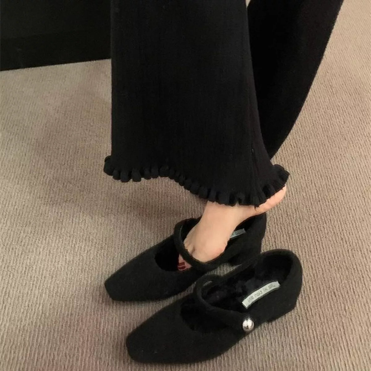 Elegant black block heel loafers by Trendsi, showcase a sleek design with a sturdy block heel and smooth leather finish.