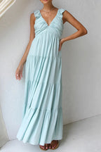 Women's cotton ruffled V-neck tiered midi dress featuring flowy fabric and ruffle details, perfect for casual or summer wear.