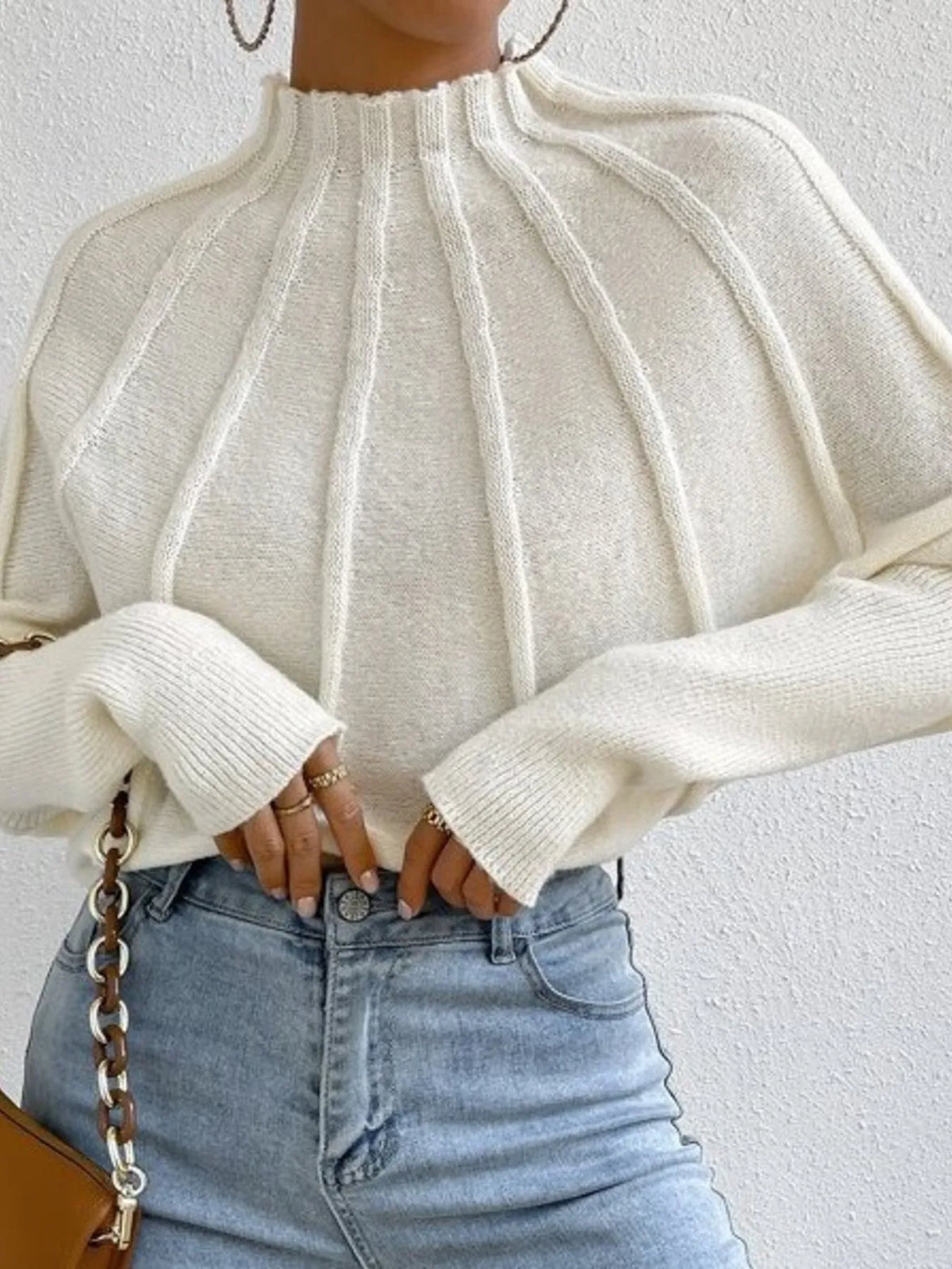 Soft beige mock neck ribbed long sleeve sweater by Trendsi, close-up of the textured knit fabric and fitted style.