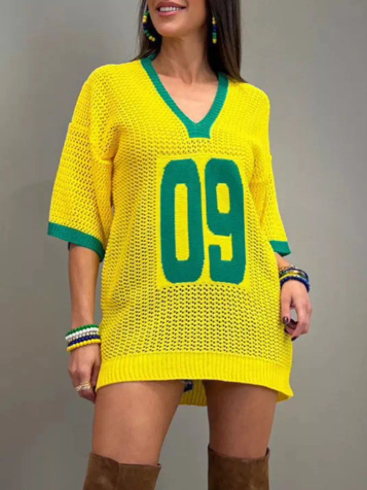 Women’s oversized V-neck openwork lightweight knit sweater by Plush Fashion Hub, showing the textured design and relaxed fit.