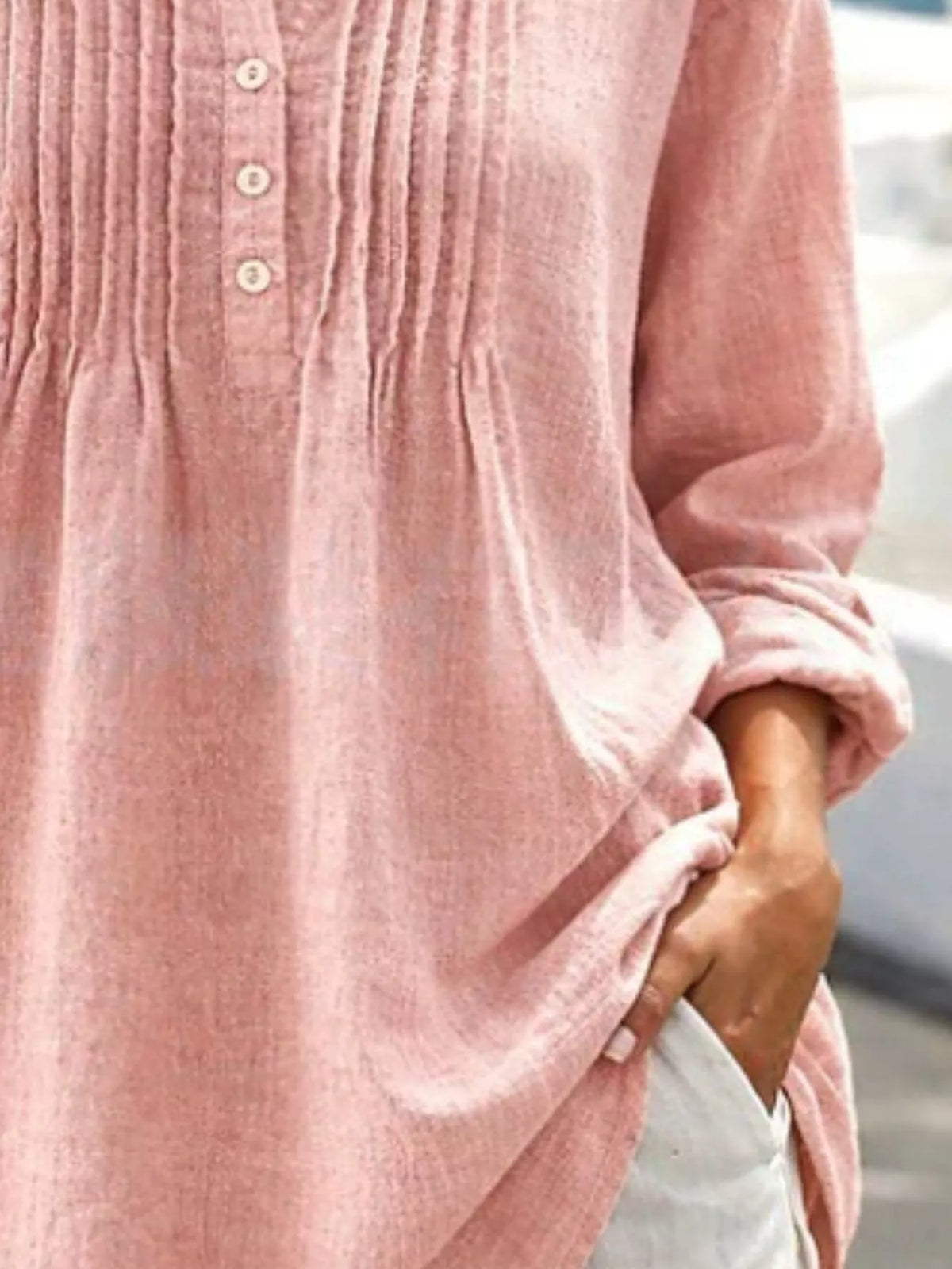 Casual linen shirt with button details and long sleeves by Trendsi, featuring a relaxed fit and natural fabric texture.