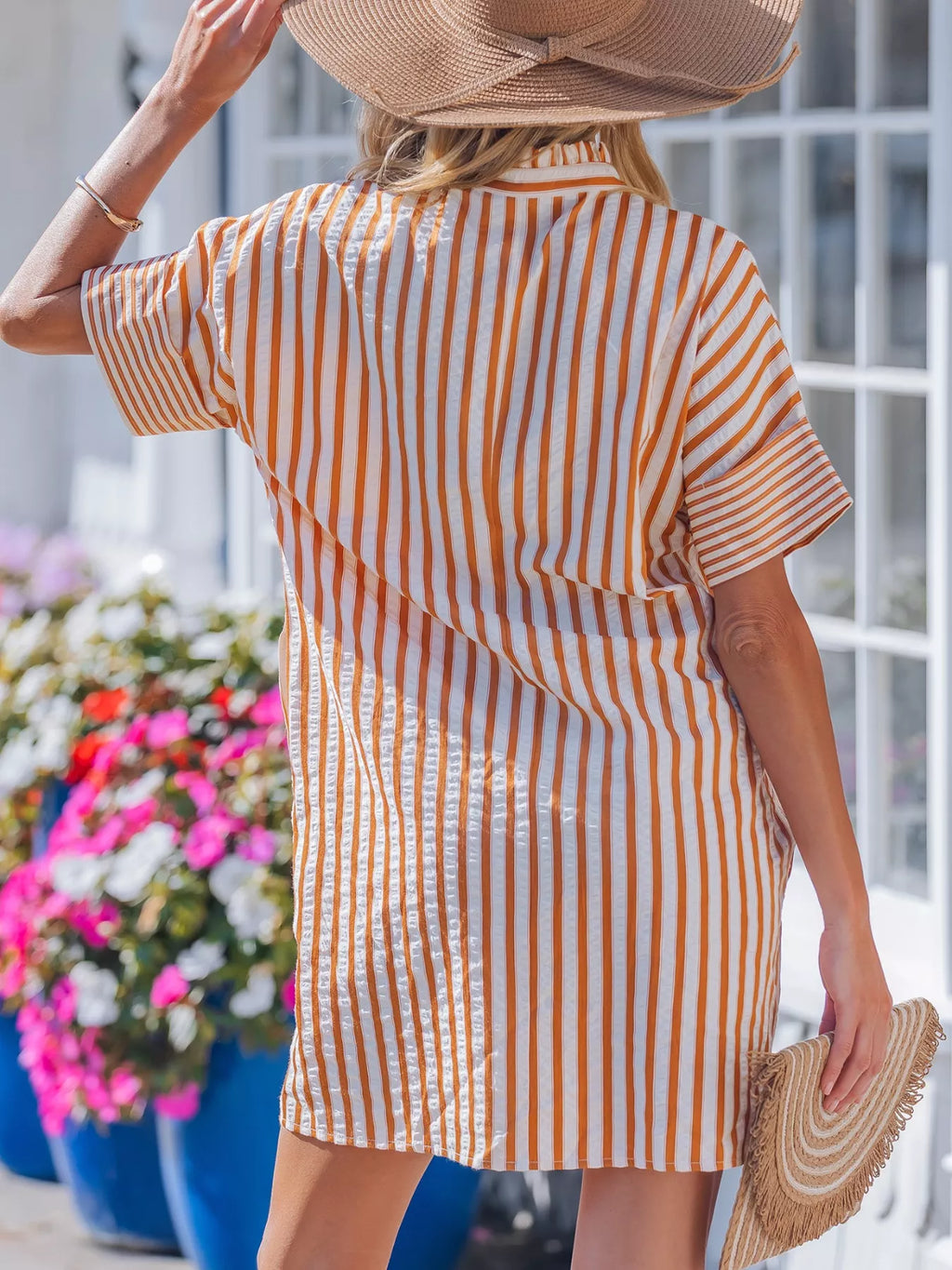 Stripe pinched V-neck mini dress by Trendsi featuring turn-up cuffs, pockets, and a fitted silhouette.