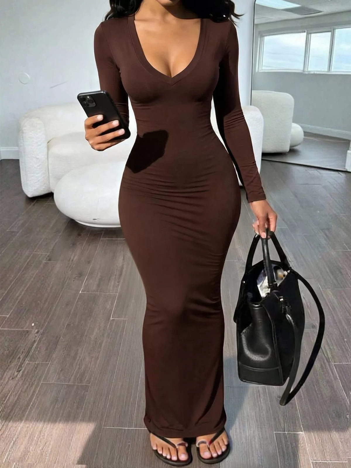 Trendsi long sleeve v-neck ruched maxi dress in soft fabric, featuring a fitted waist and flowing skirt, perfect for elegant occasions.
