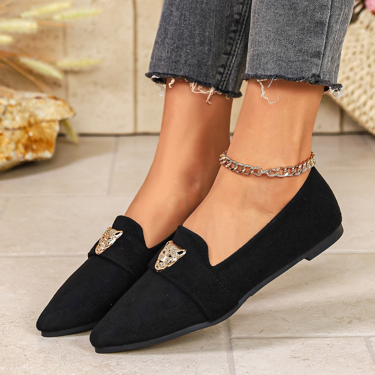 Point toe slip-on footwear by Trendsi featuring sleek design and comfortable fit, perfect for stylish everyday wear.