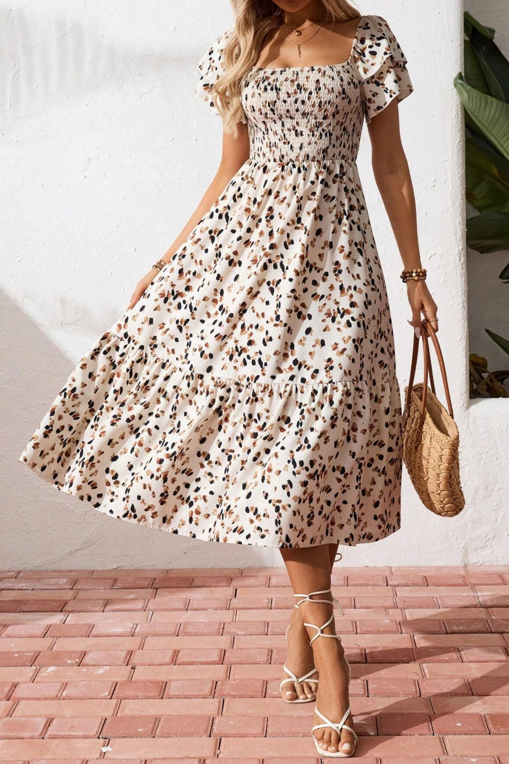 Women's square neck ruffle sleeve smocked midi dress in cotton blend, featuring a stylish design and feminine details.