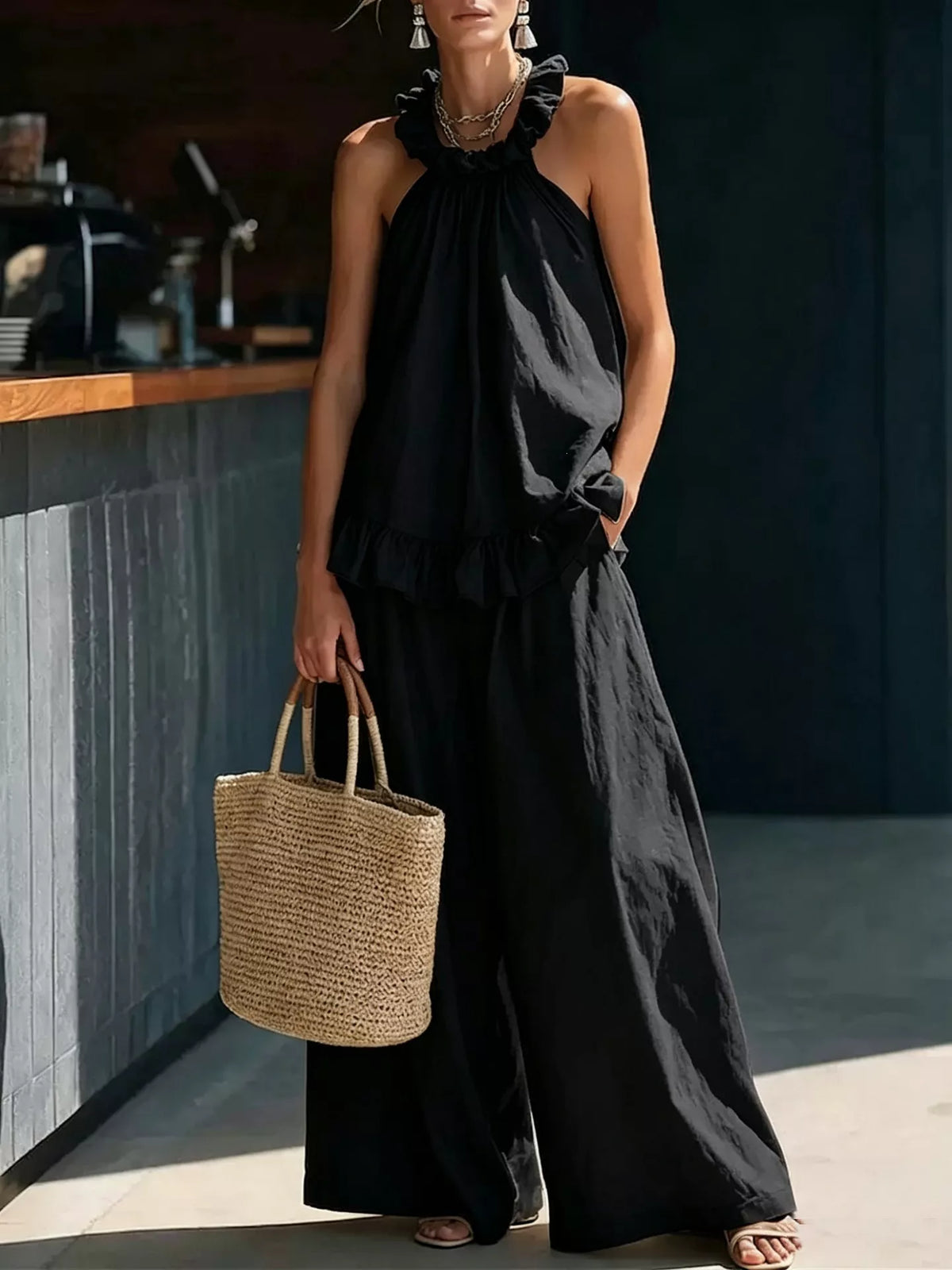 Plus size matching set by Plush Fashion Hub featuring a ruffled halter neck top and wide-leg pants, styled together for a chic look.